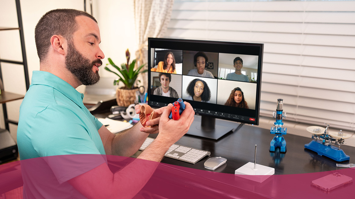 A virtual teacher in his home office gives a live video conferencing lesson on science