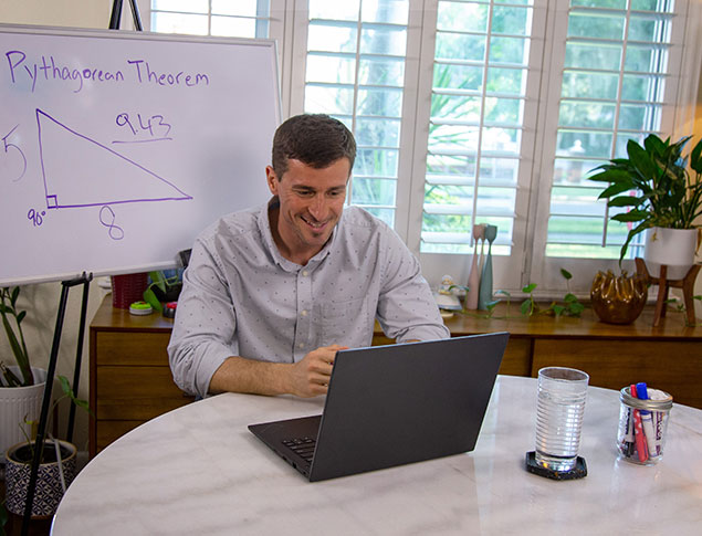 Teacher giving math lesson on computer