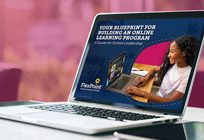 Flexpoint page on a laptop with some text and a girl smiling while using a computer